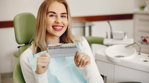 Beautiful lady in the dentist's office. Blonde sitting in a chair